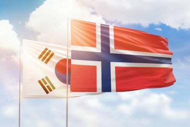 Sunny blue sky and flags of norway and south korea