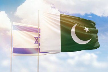 Sunny blue sky and flags of pakistan and israel