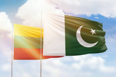 Sunny blue sky and flags of pakistan and lithuania