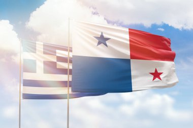 Sunny blue sky and flags of panama and greece