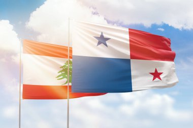 Sunny blue sky and flags of panama and lebanon