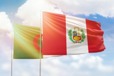 Sunny blue sky and flags of peru and algeria