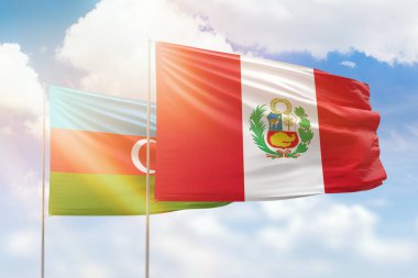 Sunny blue sky and flags of peru and azerbaijan