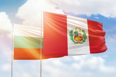 Sunny blue sky and flags of peru and bulgaria