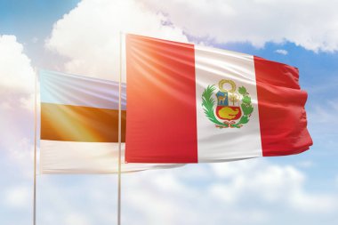 Sunny blue sky and flags of peru and estonia