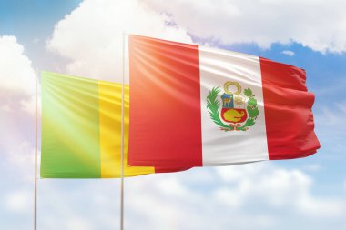 Sunny blue sky and flags of peru and mali