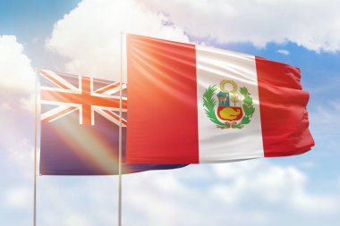 Sunny blue sky and flags of peru and new zealand