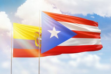 Sunny blue sky and flags of puerto rico and ecuador