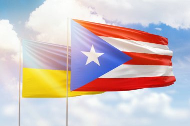 Sunny blue sky and flags of puerto rico and ukraine