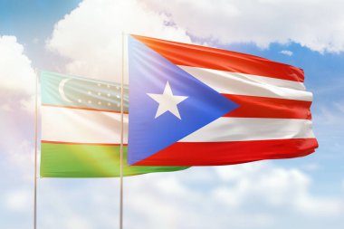 Sunny blue sky and flags of puerto rico and uzbekistan