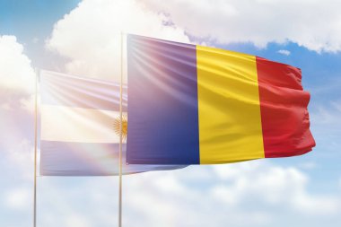Sunny blue sky and flags of romania and argentina