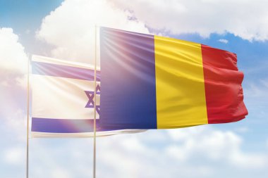 Sunny blue sky and flags of romania and israel
