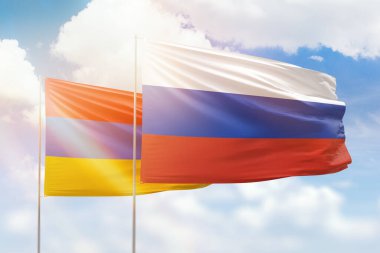 Sunny blue sky and flags of russia and armenia