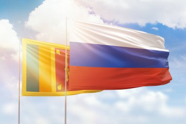 Sunny blue sky and flags of russia and sri lanka