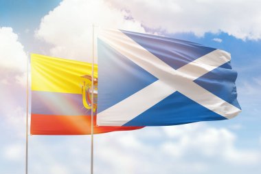 Sunny blue sky and flags of scotland and ecuador