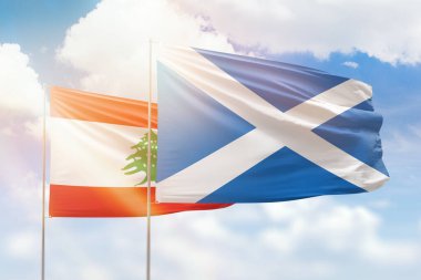 Sunny blue sky and flags of scotland and lebanon