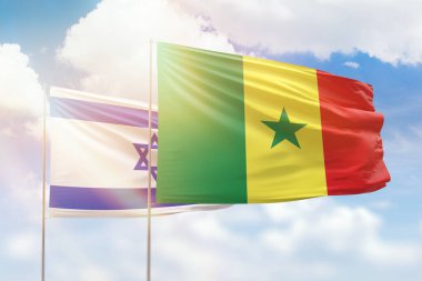 Sunny blue sky and flags of senegal and israel