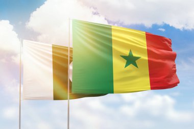 Sunny blue sky and flags of senegal and pakistan