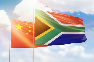 Sunny blue sky and flags of south africa and china