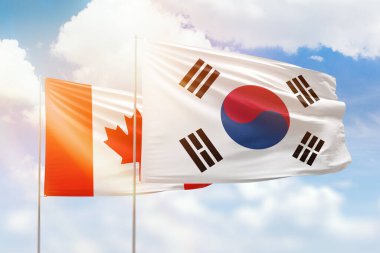 Sunny blue sky and flags of south korea and canada
