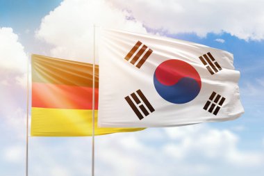 Sunny blue sky and flags of south korea and germany