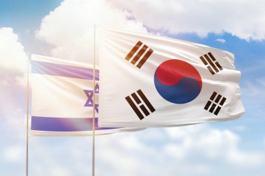 Sunny blue sky and flags of south korea and israel