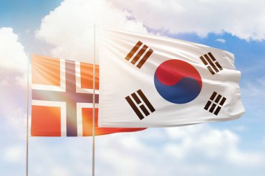 Sunny blue sky and flags of south korea and norway