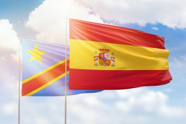Sunny blue sky and flags of spain and dr congo