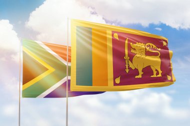 Sunny blue sky and flags of sri lanka and south africa
