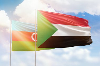 Sunny blue sky and flags of sudan and azerbaijan