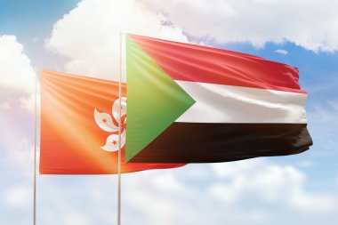 Sunny blue sky and flags of sudan and hong kong