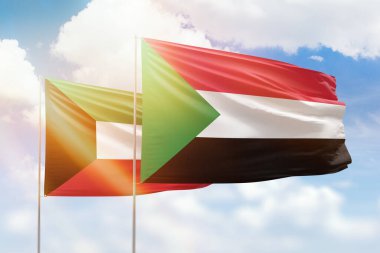 Sunny blue sky and flags of sudan and kuwait