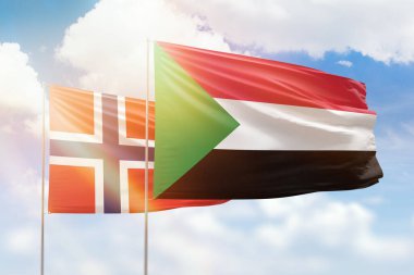 Sunny blue sky and flags of sudan and norway