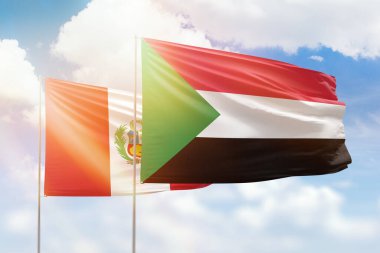 Sunny blue sky and flags of sudan and peru