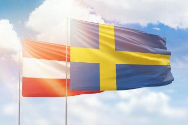 Sunny blue sky and flags of sweden and austria