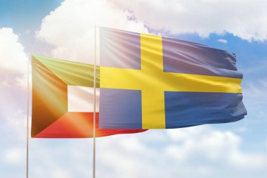 Sunny blue sky and flags of sweden and kuwait