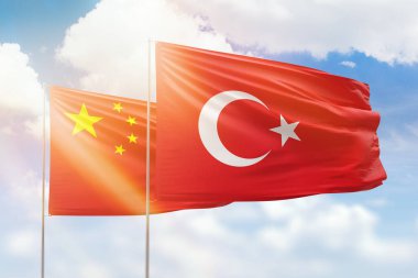 Sunny blue sky and flags of turkey and china