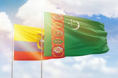 Sunny blue sky and flags of turkmenistan and ecuador
