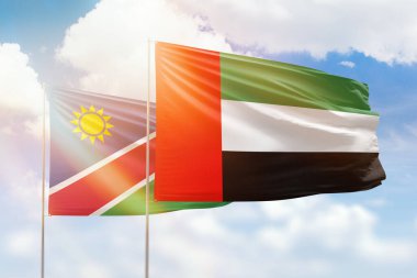 Sunny blue sky and flags of united arab emirates and namibia