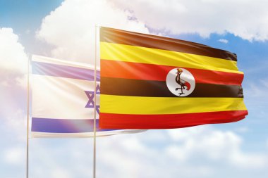 Sunny blue sky and flags of uganda and israel