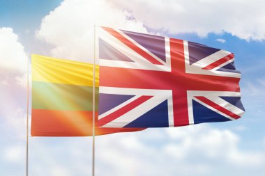 Sunny blue sky and flags of united kingdom and lithuania