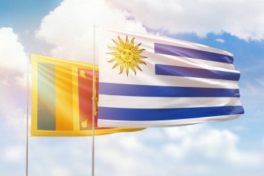 Sunny blue sky and flags of uruguay and sri lanka