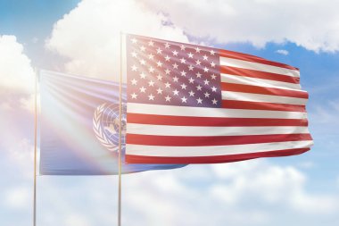 Sunny blue sky and flags of united states of america and united nations