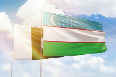 Sunny blue sky and flags of uzbekistan and pakistan
