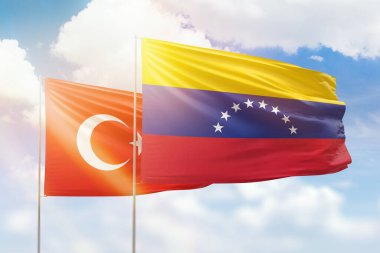 Sunny blue sky and flags of venezuela and turkey