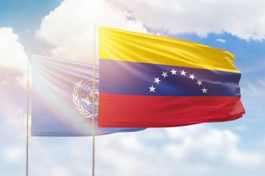 Sunny blue sky and flags of venezuela and united nations