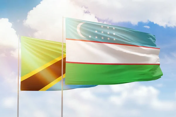 Sunny Blue Sky Flags Uzbekistan Tanzania — Fotografia de Stock