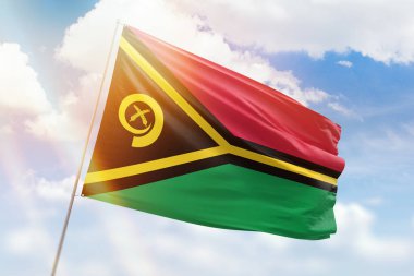 Güneşli mavi gökyüzü ve vanuatu bayrağıyla bayrak direği