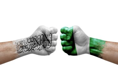 Two hands punch to each others on white background. Country flags painted fists, conflict crisis concept between afghanistan and nigeria