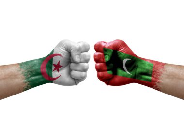 Two hands punch to each others on white background. Country flags painted fists, conflict crisis concept between algeria and maldives